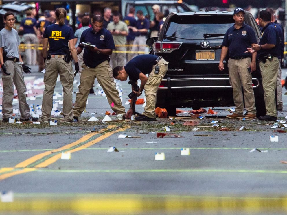 Members of the Federal Bureau of Investigation carry on investigations at the scene of Saturday's explosion on West 23rd Street and Sixth Avenue in Manhattan's Chelsea neighborhood, New York, Sept. 18, 2016.