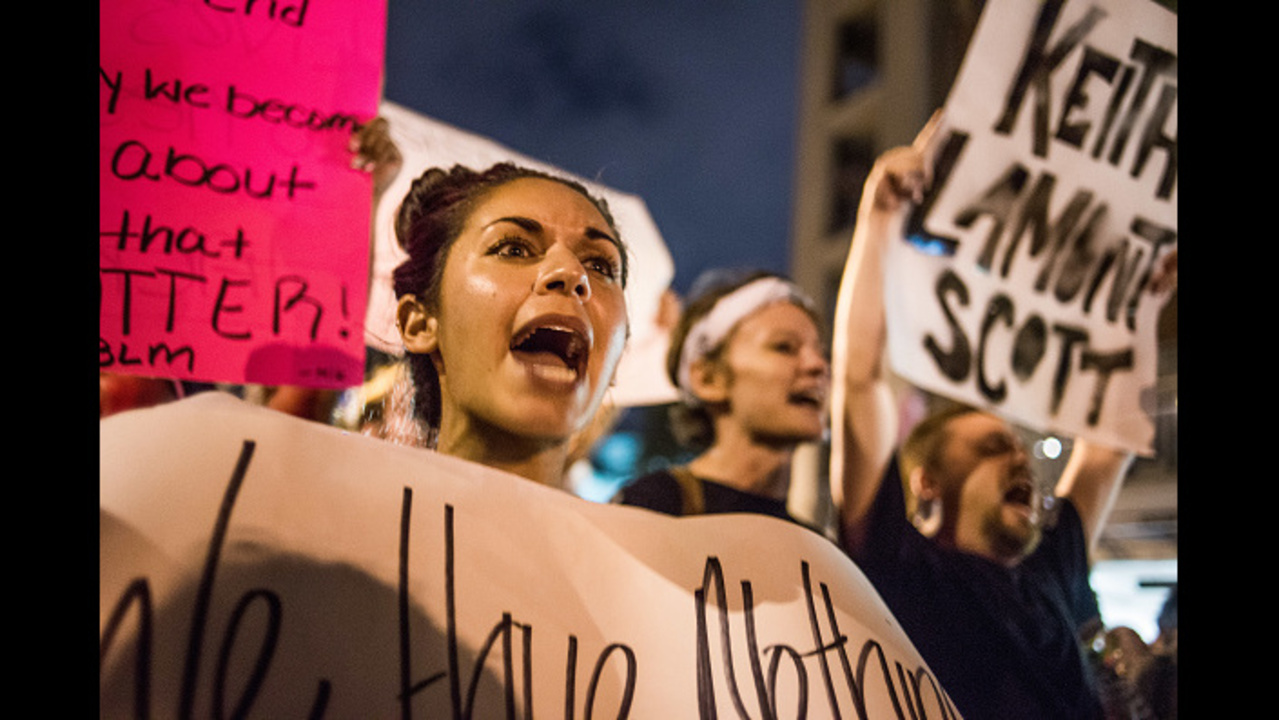 CHARLOTTE, NC - SEPTEMBER 22: Demonstrators shout during protests September 22, 2016 in Charlotte, NC. Protests began on Tuesday night following the fatal shooting of 43-year-old Keith Lamont Scott at an apartment complex near UNC Charlotte .A state of emergency was declared overnight in Charlotte and a midnight curfew was imposed by mayor Jennifer Roberts, to be lifted at 6 a.m. (Photo by Sean Rayford/Getty Images)