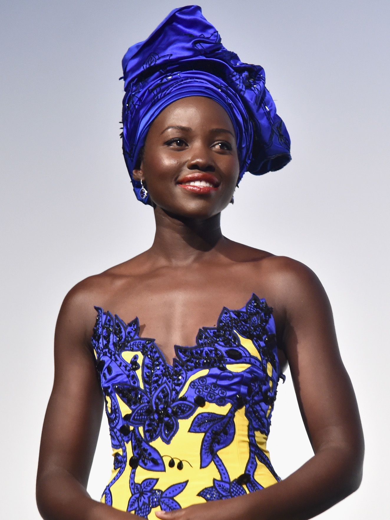 The gown is by Carolina Herrera.