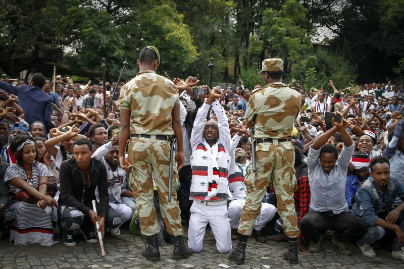 Ethiopian soldiers try to stop protesters in Bishoftu, in the Oromia region of Ethiopia, Sunday, Oct. 2, 2016. CREDIT: AP Photo, File