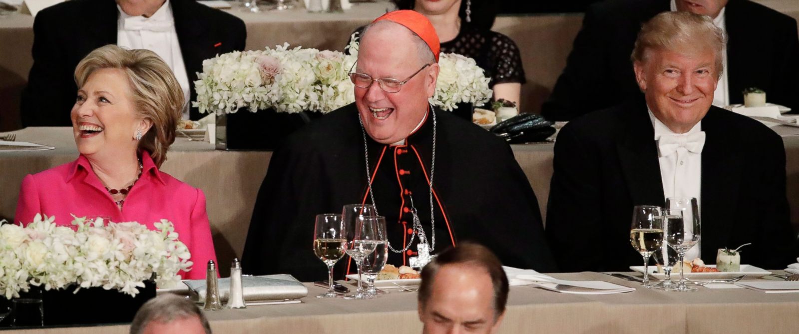 Democratic presidential candidate Hillary Clinton, Cardinal Timothy Dolan and Republican presidential candidate Donald Trump.