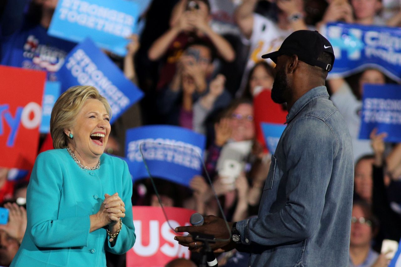 NBA basketball player Lebron James (R) introduces U.S. Democratic presidential nominee Hillary Clinton during a campaign rally in Cleveland, Ohio, U.S., November 6, 2016. REUTERS/Carlos Barria  