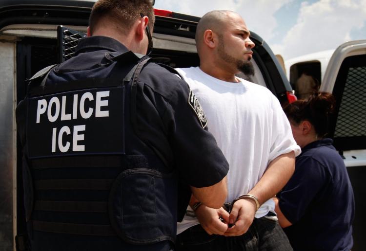File: A van chartered by U.S. Immigration and Customs Enforcement which will take these undocumented immigrants to the border to be deported.