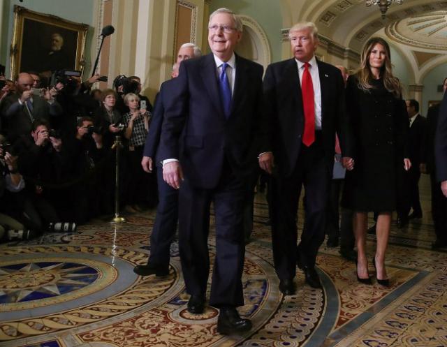Senate Majority Leader Mitch McConnell (2L), walks with President-elect Donald Trump, his wife Melania Trump, and Vice President-elect Mike Pence (L), at the U.S. Capitol for a meeting November 10, 2016 in Washington, DC. Earlier in the day president-elect Trump met with U.S. President Barack Obama at the White House. (Mark Wilson/Getty Images)